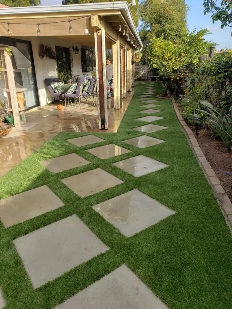 Artificial grass with concrete paver walkway in San Diego, CA by TurboSurfacing