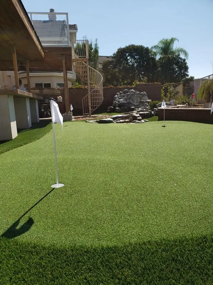 Short-pile artificial turf lawn game surface installed in by Turbo Surfacing Solutions