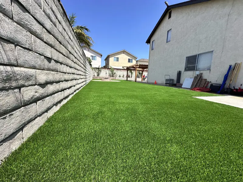 Artificial grass backyard lawn installed in San Diego by Turbo Surfacing Solutions