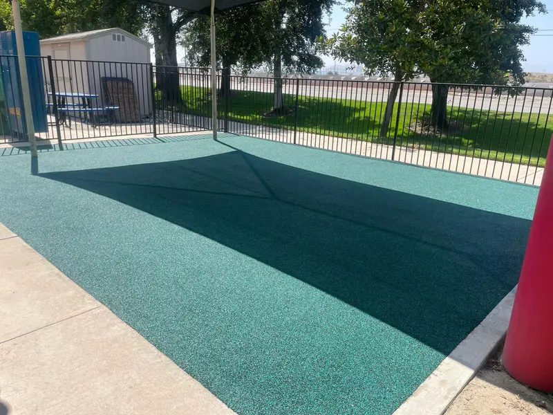 Splash pad rubber surfacing — Turbo Surfacing Solutions Seamless poured-in-place rubber surfacing at a play area installed by Turbo Surfacing Solutions