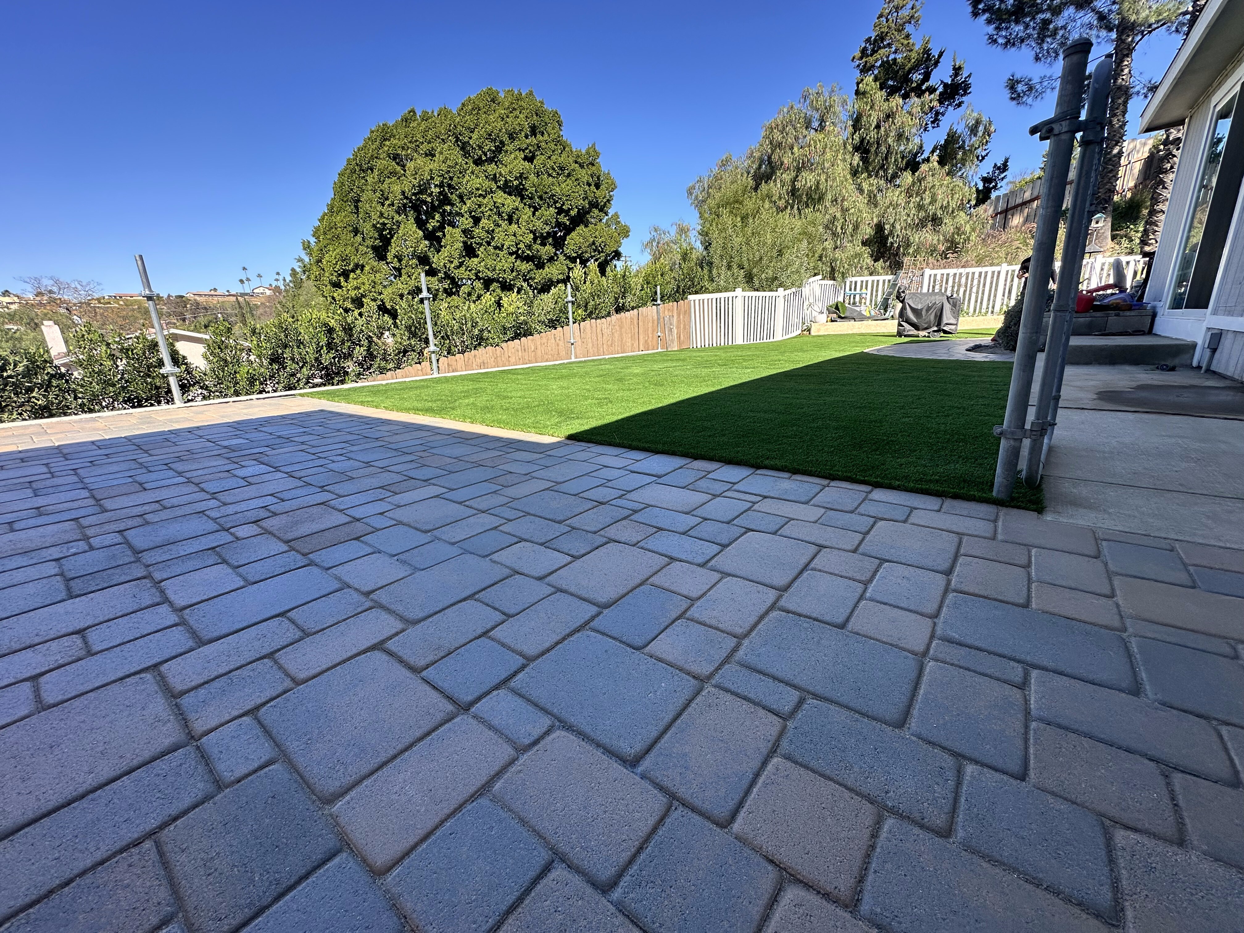 Paver patio with artificial grass lawn in San Diego, CA by TurboSurfacing