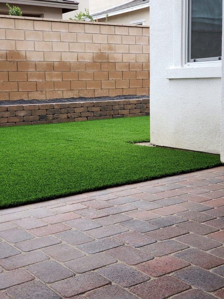 Artificial grass with concrete paver walkway in San Diego, CA by TurboSurfacing