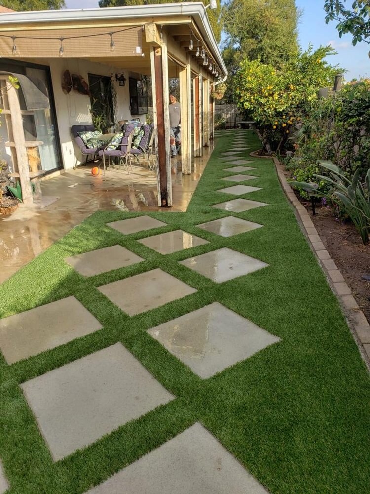 Artificial grass with concrete paver walkway in San Diego, CA by TurboSurfacing