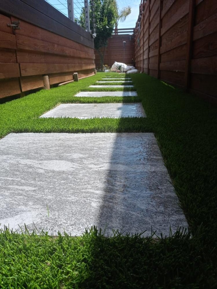 Artificial grass with concrete paver walkway in San Diego, CA by TurboSurfacing