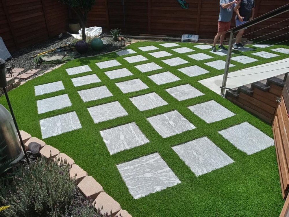 Artificial grass with concrete paver walkway in San Diego, CA by TurboSurfacing
