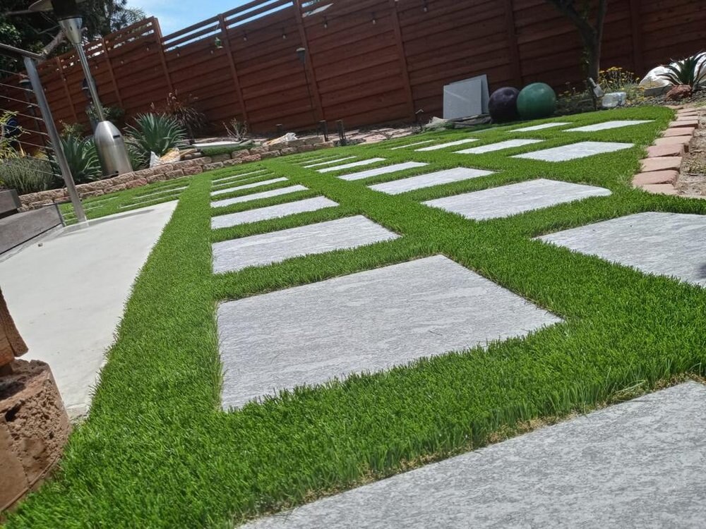 Artificial grass with concrete paver walkway in San Diego, CA by TurboSurfacing