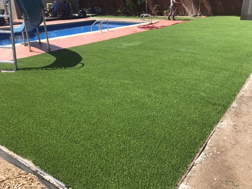 Artificial grass pool deck surround in San Diego, CA by TurboSurfacing