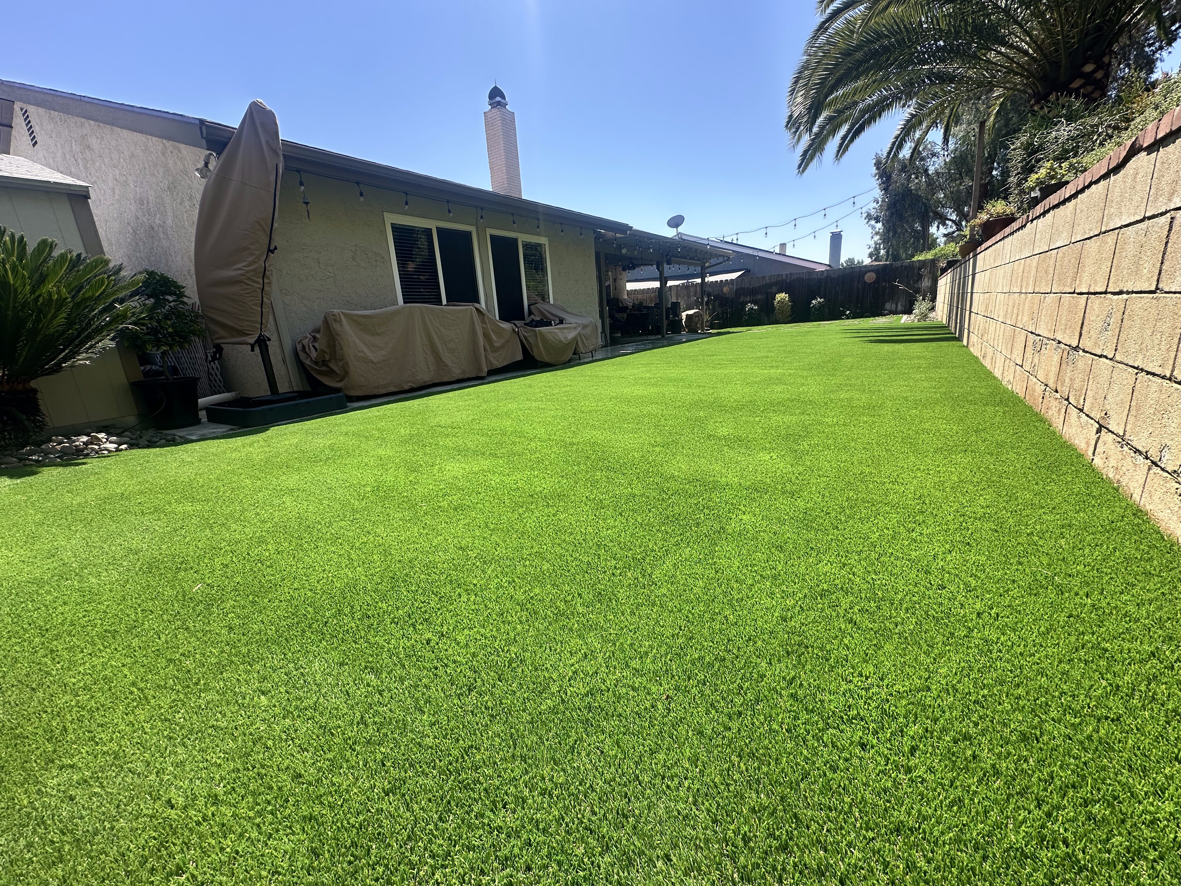 Artificial grass residential backyard in San Diego, CA by TurboSurfacing