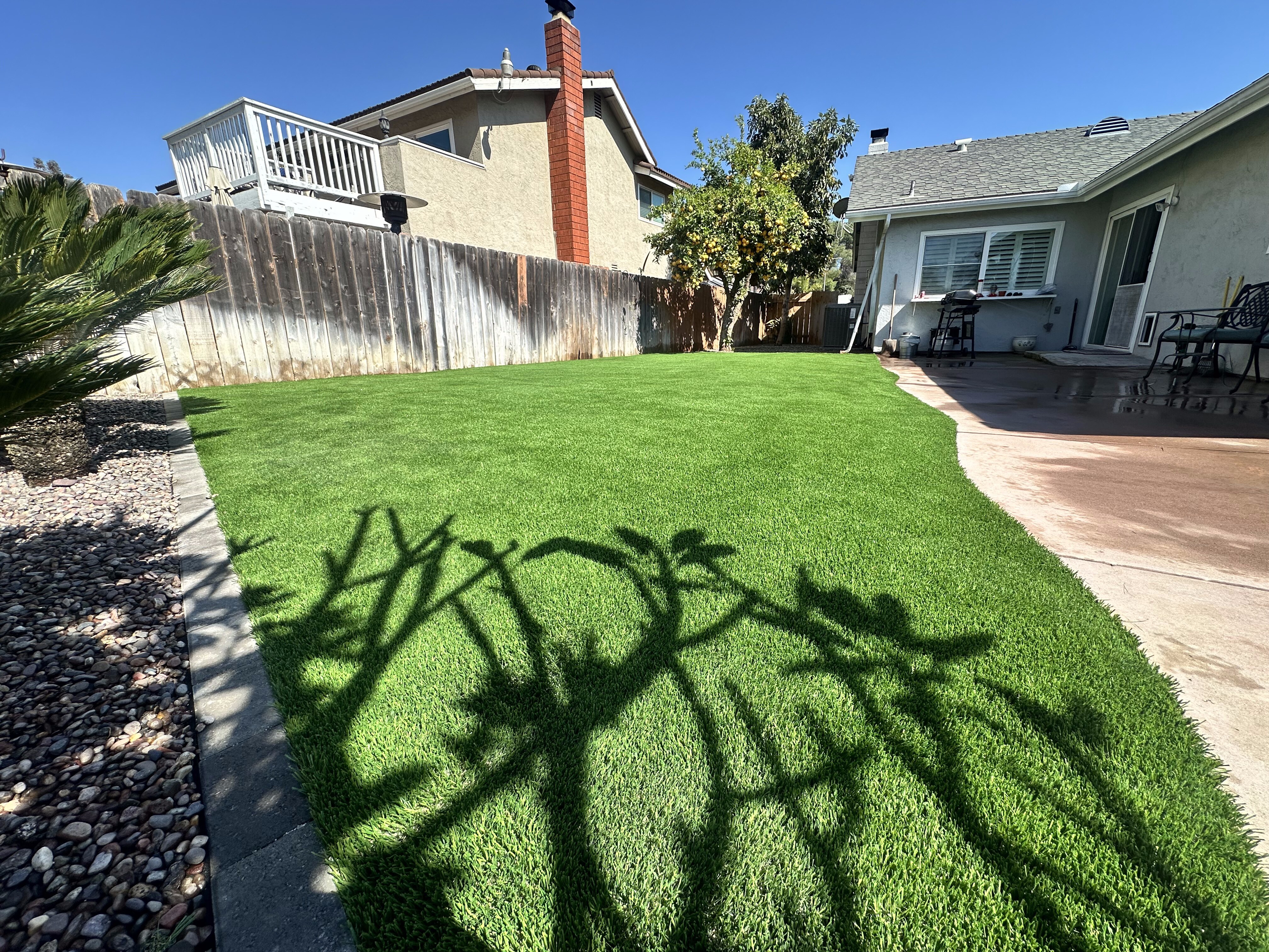 Artificial grass residential backyard lawn installed in San Diego, CA by Turbo Surfacing Solutions